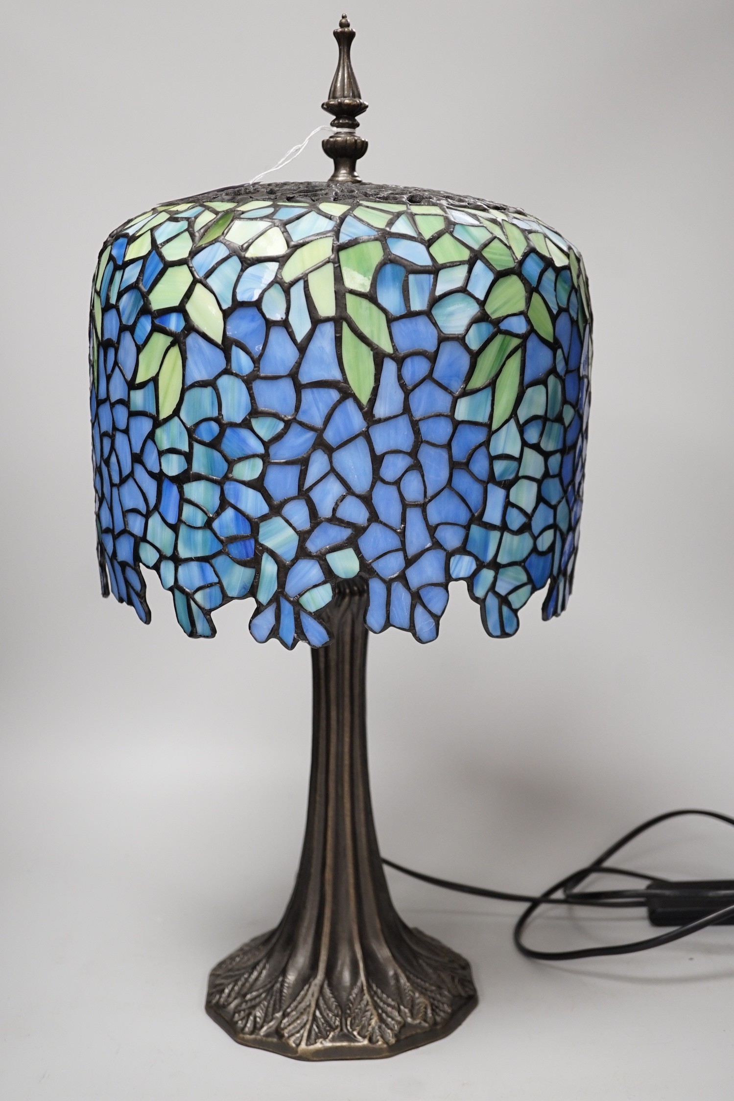 A Tiffany style stained glass lamp. 54cm tall